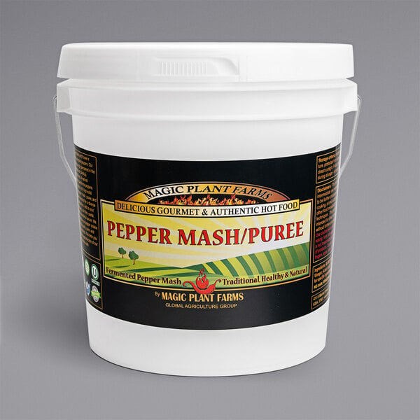 A white gallon bucket of Fiery Farms Carolina Reaper pepper puree with a label.
