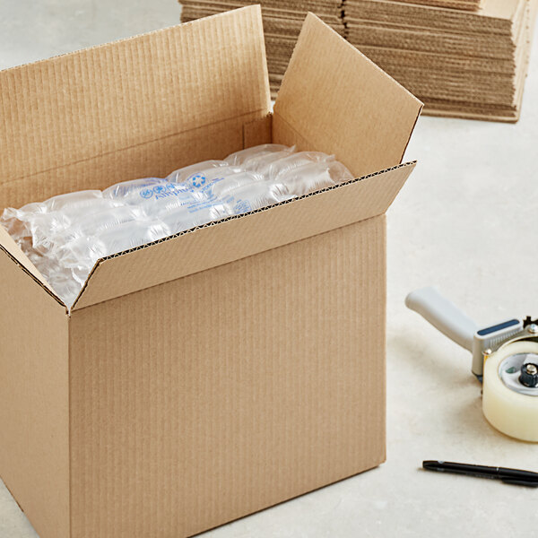 A Lavex kraft corrugated shipping box with plastic bottles inside.