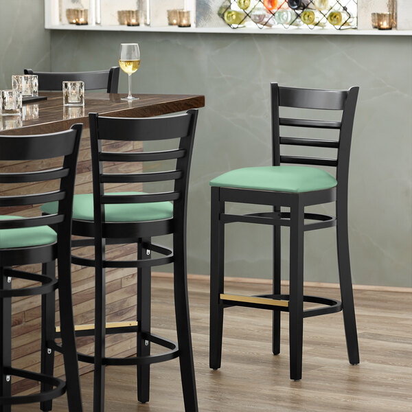 Lancaster Table & Seating Black Finish Wooden Ladder Back Bar Height Chair with Seafoam Padded Seat