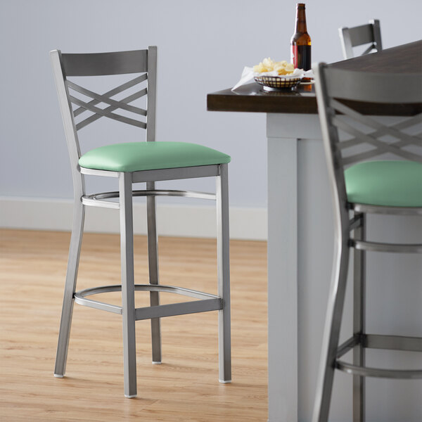 Lancaster Table & Seating Clear Coat Cross Back Bar Height Chair with Seafoam Padded Seat - Preassembled