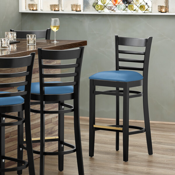 Lancaster Table & Seating Black Finish Wooden Ladder Back Bar Height Chair with Blue Padded Seat