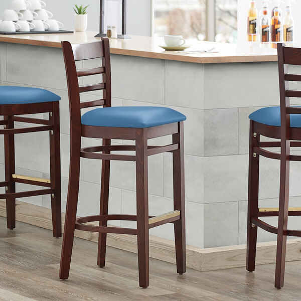 Lancaster Table & Seating Mahogany Finish Wooden Ladder Back Bar Height Chair with Blue Padded Seat