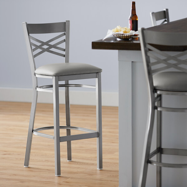 Lancaster Table & Seating Clear Coat Cross Back Bar Height Chair with Light Gray Padded Seat - Preassembled