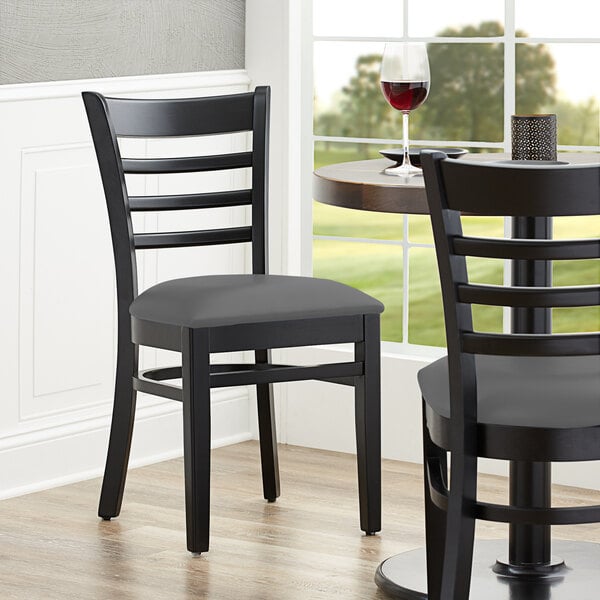 Lancaster Table & Seating Black Finish Wooden Ladder Back Chair with Dark Gray Padded Seat