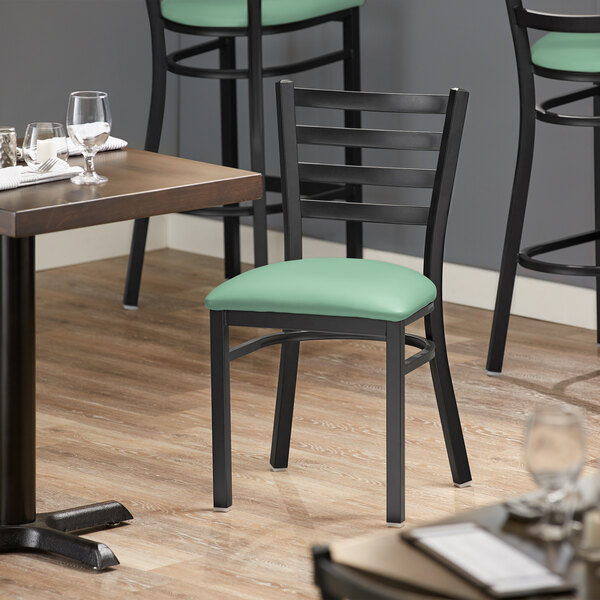 Lancaster Table & Seating Black Finish Ladder Back Chair with 2 1/2" Seafoam Vinyl Padded Seat