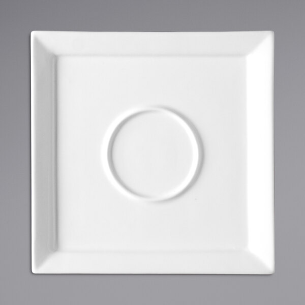 A Fortessa Fortaluxe Tavola bright white square porcelain saucer with a white circle in the center.