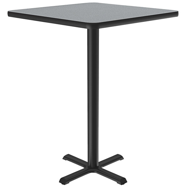 A Correll square bar height table with a black base and gray granite finish.