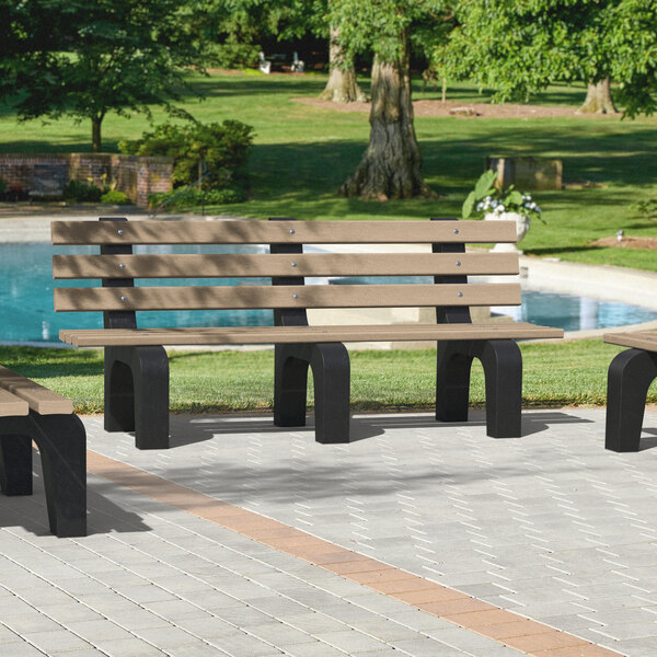 A group of MasonWays cedar benches with black legs next to a pool.