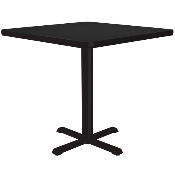 A Correll black granite square table with a metal base.