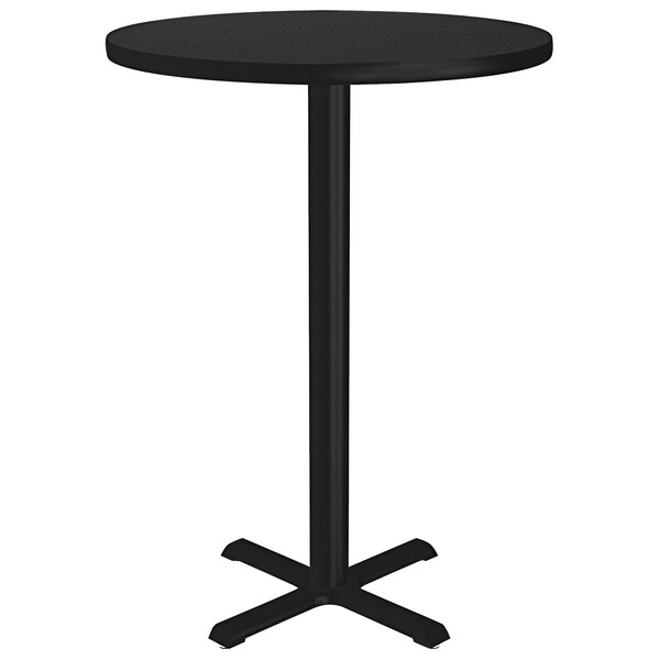A Correll black granite round table on a metal base.