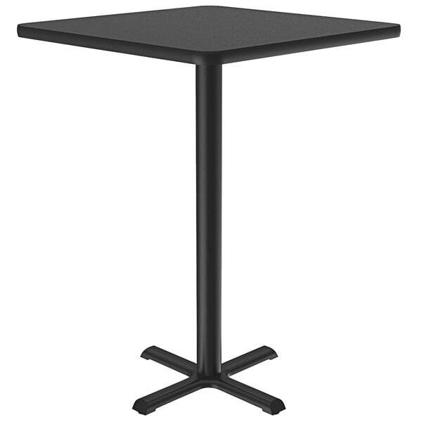 A Correll black square bar height table with metal legs.