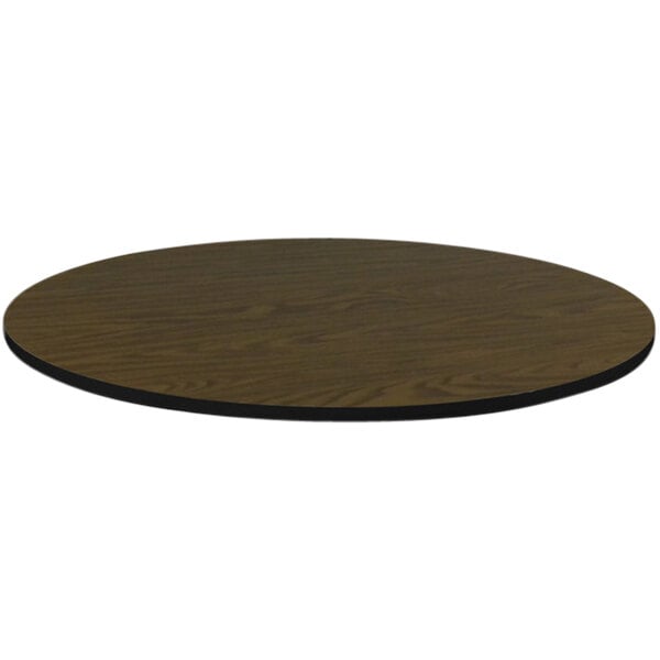A Correll round walnut laminate table top with a black edge.