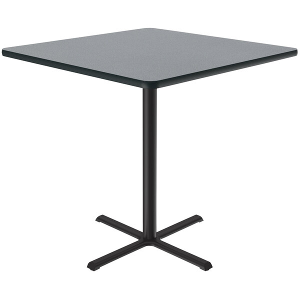 A Correll grey granite square bar height table with a black base.