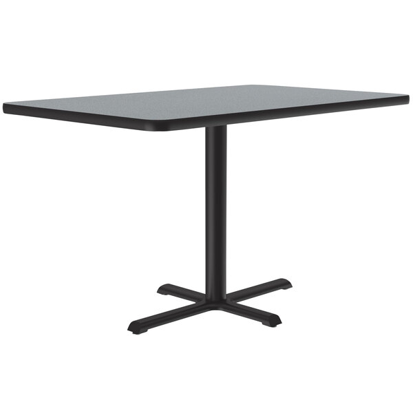 A rectangular Correll table with a black granite finish top and base.