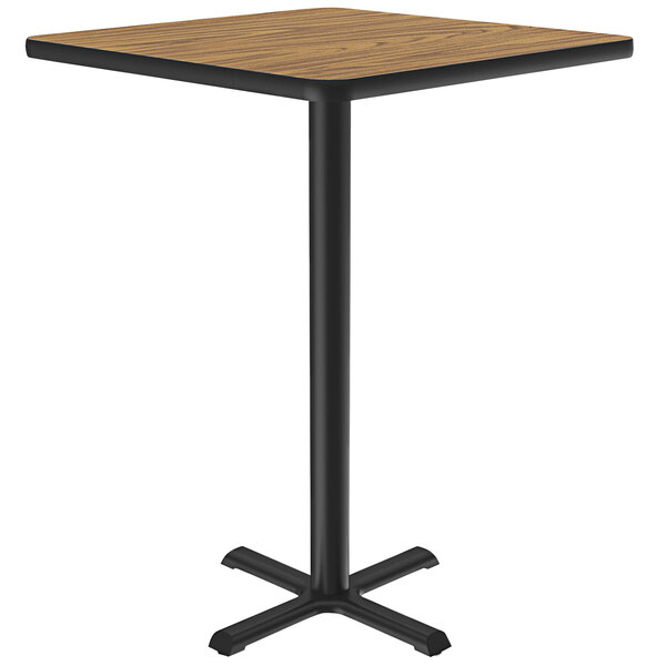 A Correll square table with a medium oak finish thermal-fused laminate top and black base.