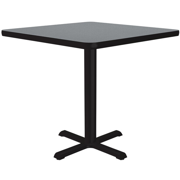 A square gray granite Correll table with a black base.