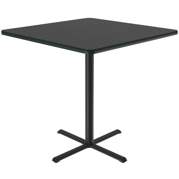 A Correll black square table with a black metal base.