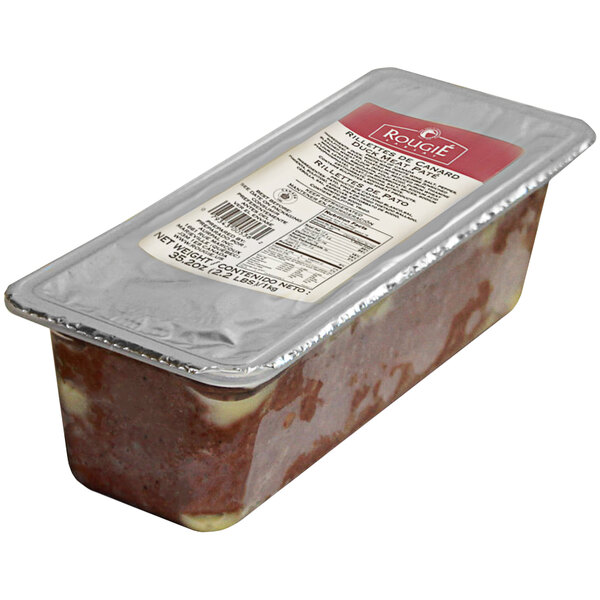 A plastic container of Rougie Duck Rillettes Pate on a deli counter.