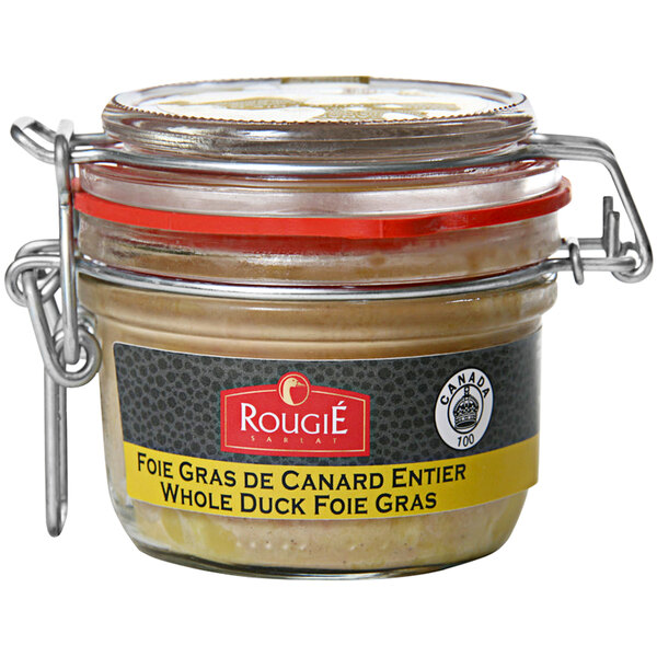A jar of Rougie Whole Armagnac Foie Gras on a table with a label.