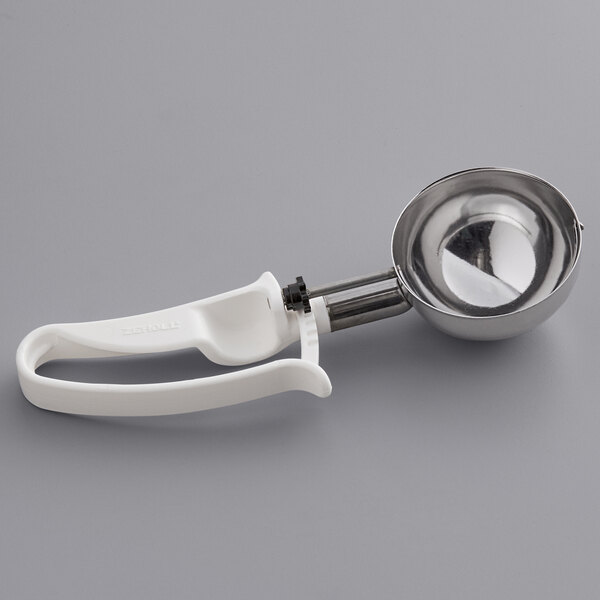 A Zeroll white plastic ice cream scoop with a silver handle.