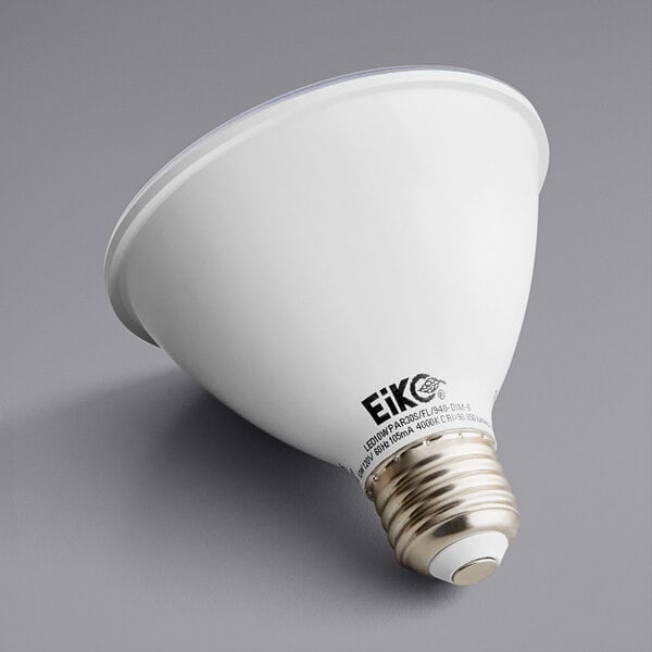 An Eiko LED light bulb with black text on a grey surface.