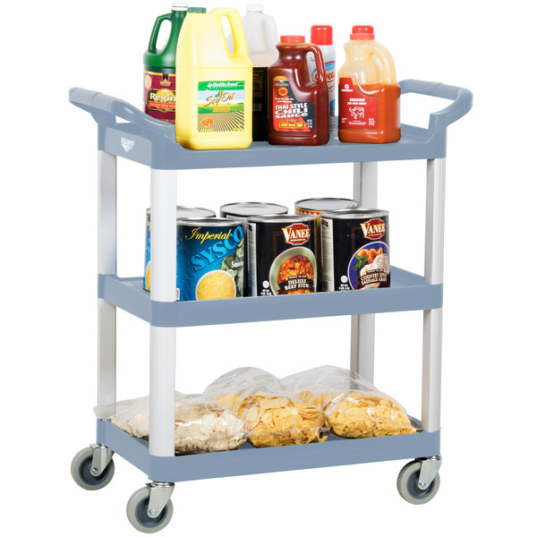 A Vollrath gray plastic utility cart with three shelves holding food and beverages.