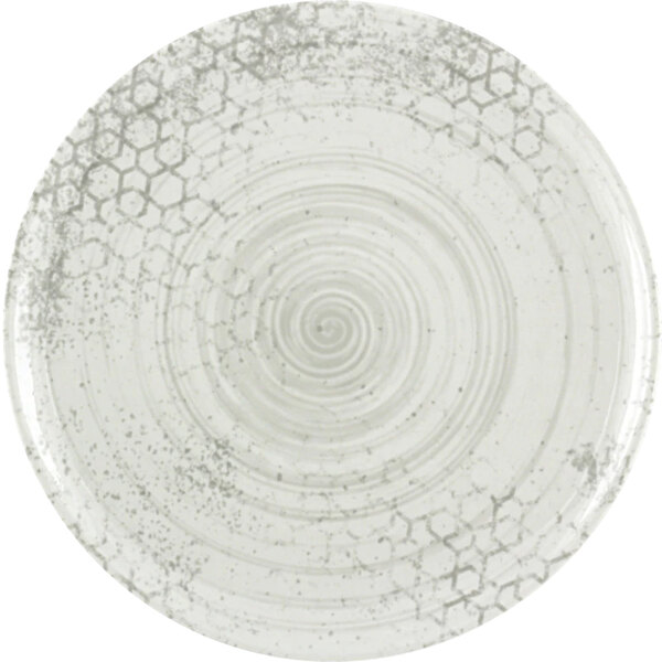 A white porcelain Bauscher plate with a swirly design.