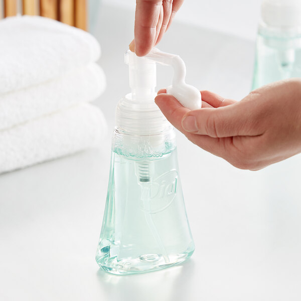 A person using a pump of Dial Fresh Pear Antibacterial Foaming Hand Wash.