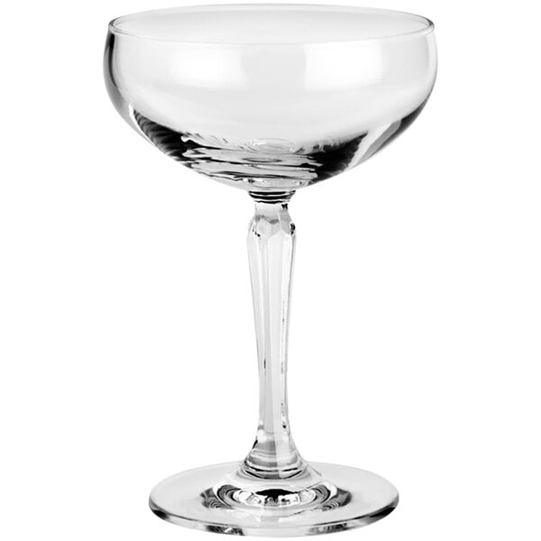 A clear Connexion coupe glass with a stem.