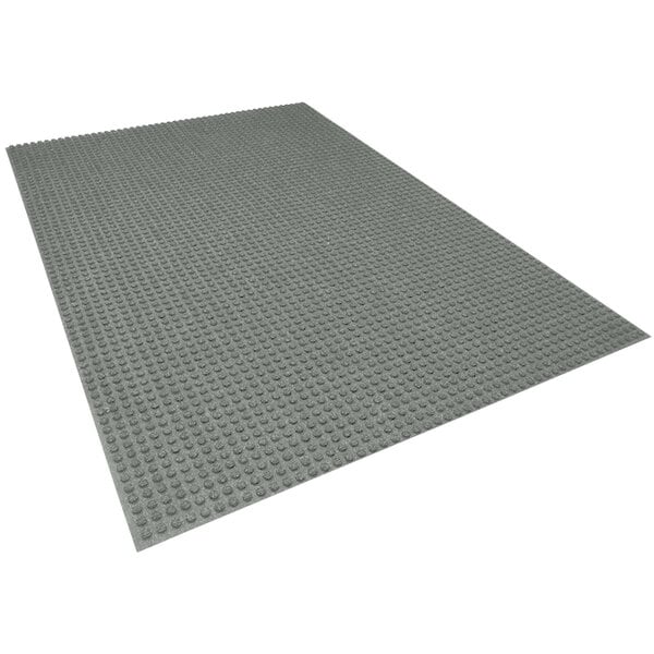 A grey rectangular mat with a grid pattern.