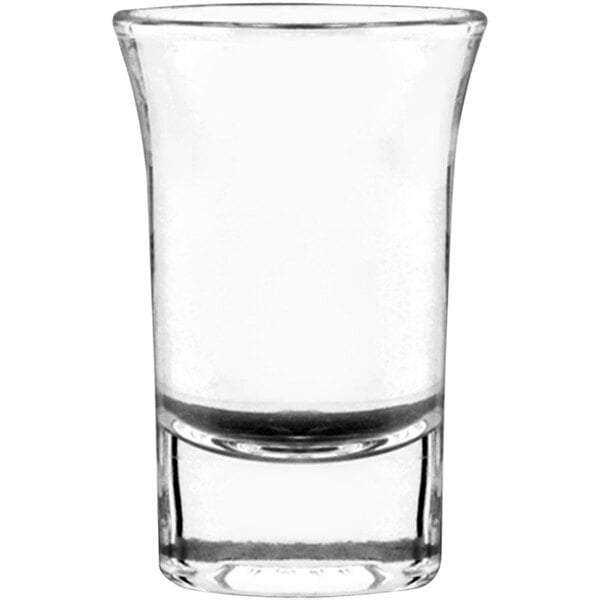 An Anchor Hocking Tequila shot glass with a small rim.