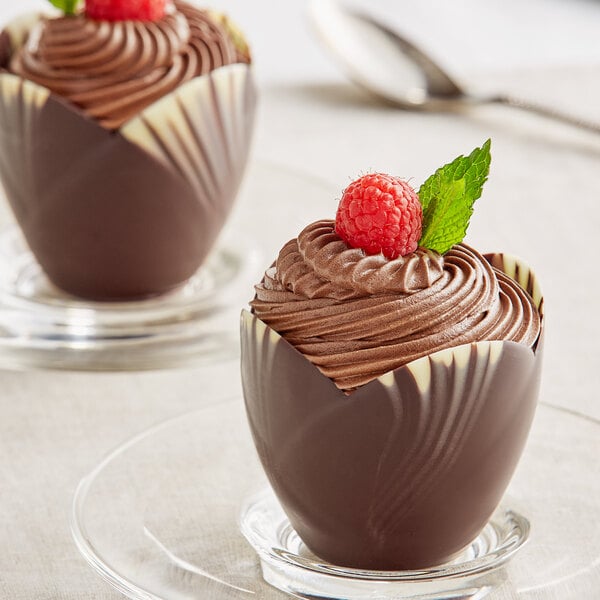 A marbled chocolate tulip cup filled with chocolate desserts.