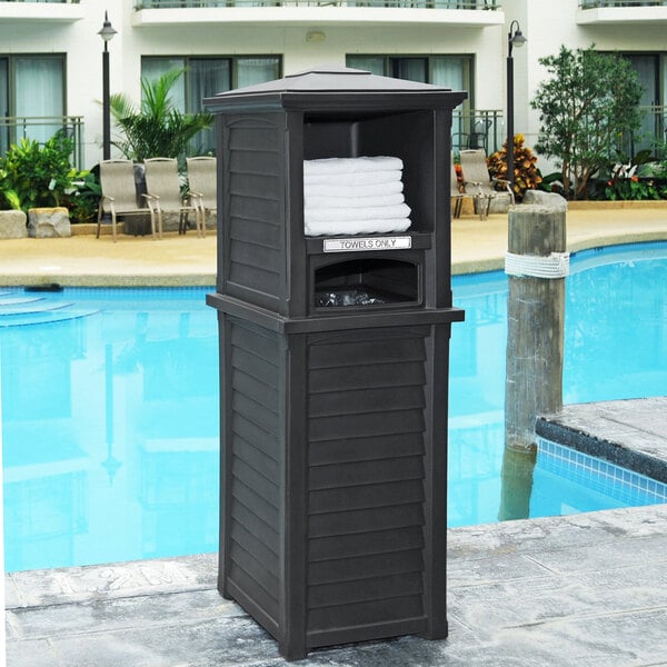 A black rectangular outdoor towel valet with a white towel on top.