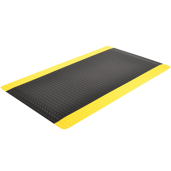 A black and yellow Notrax Cushion Trax anti-fatigue mat with a black border.