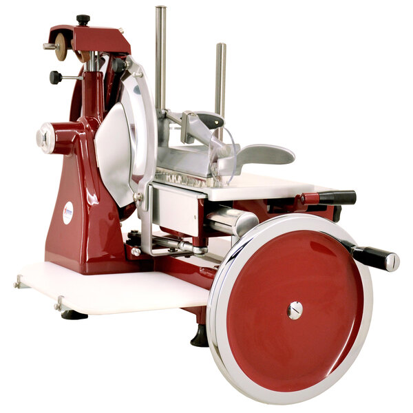 An Omcan red and white manual meat slicer with a red handle.