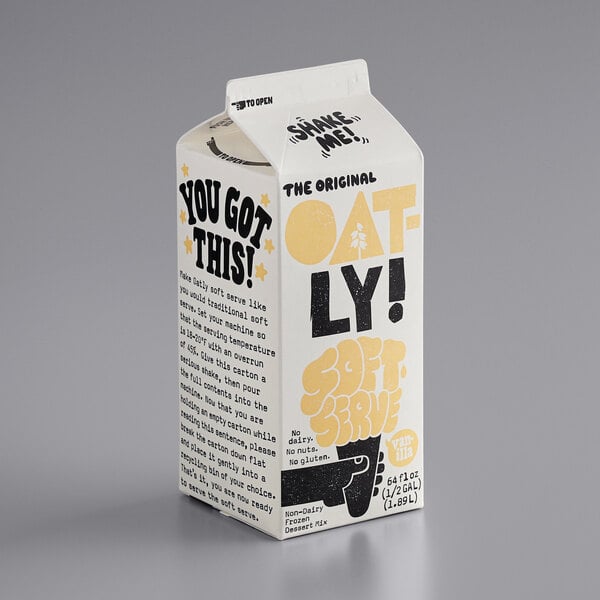 A white carton of Oatly Vanilla Oat Milk Soft Serve Base with yellow and black text.