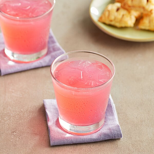 Two glasses of Old Orchard Strawberry Lemonade.