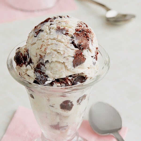 A scoop of Brownie Bites ice cream in a bowl.