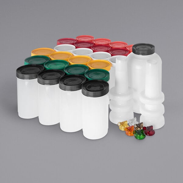 A Carlisle Store N' Pour Bar Service Pack with white containers and different colored lids.