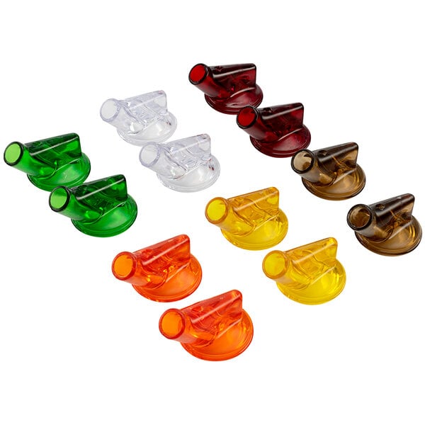 A group of yellow, orange, and red plastic spouts with assorted color tops.