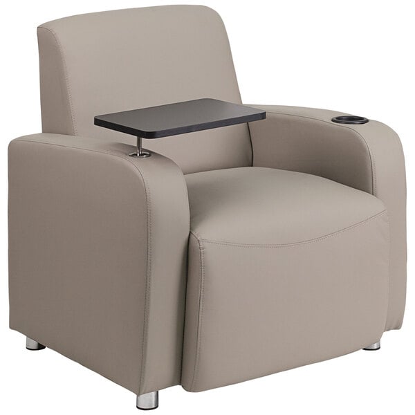 A Flash Furniture gray LeatherSoft guest chair with a tablet arm and cup holder in a lounge area.
