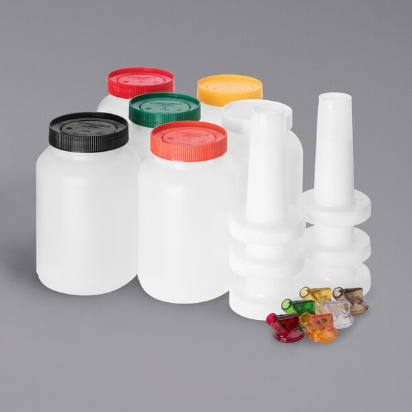 A group of Carlisle Store N' Pour plastic containers with different colored caps.