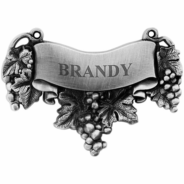 A silver Franmara decanter label with the word "Brandy" on it.