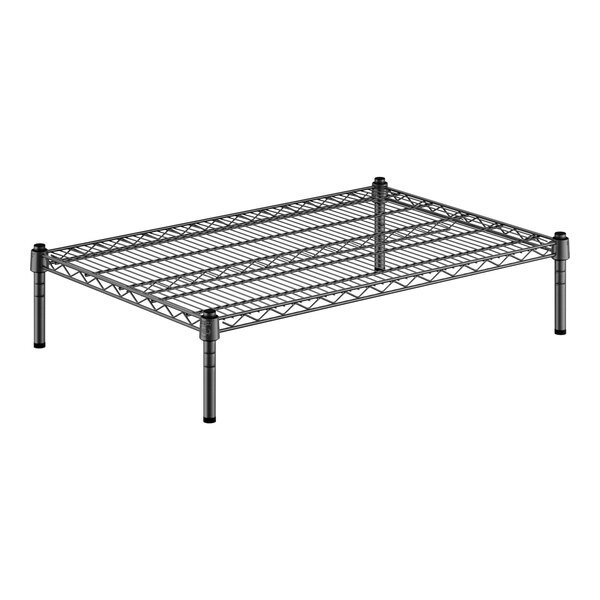 A black wire dunnage rack with metal legs.