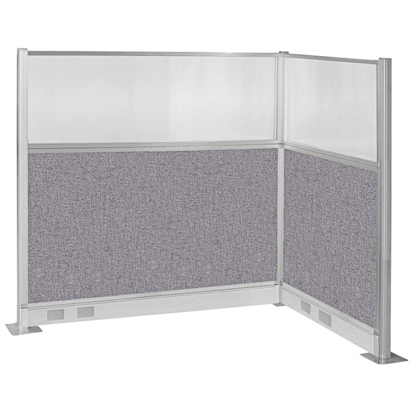A gray fabric cubicle partition with a window and electric channel.