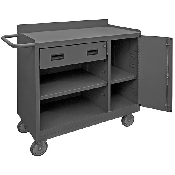 A gray metal mobile workstation with 1 door open.