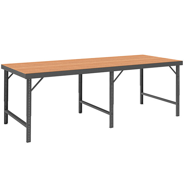 A long rectangular Durham workbench with a tempered hardboard top and gray metal legs.