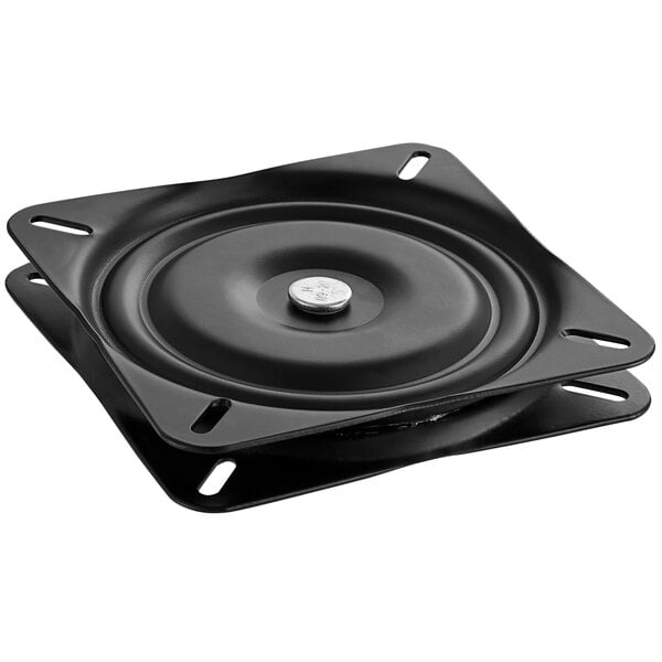 A black square swivel plate with a round metal surface.