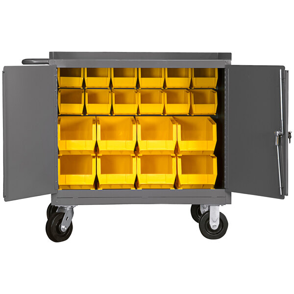 A large grey cart with yellow bins inside.