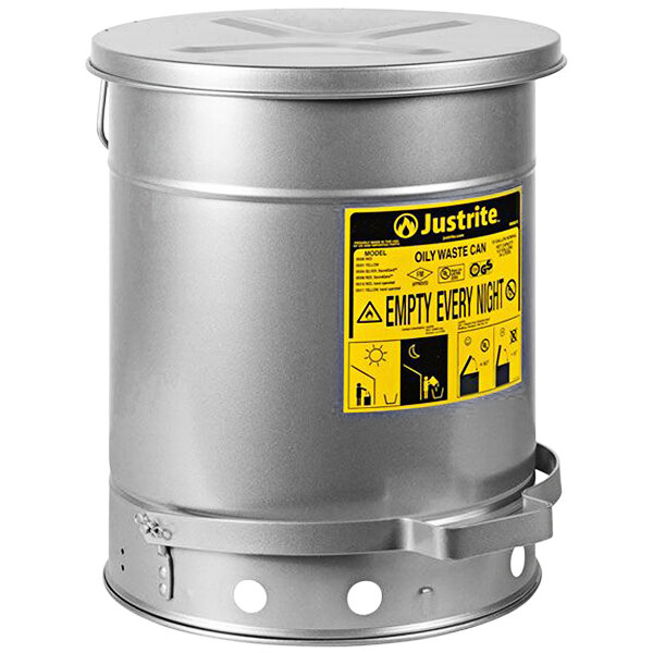 A silver metal Justrite oily waste can with a yellow label.